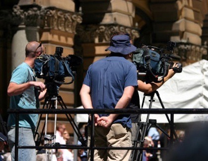 A job in television may cause you to film on location, like this director and crew