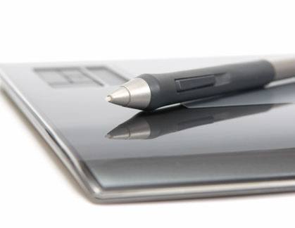 closeup of digitizer with pen on white background