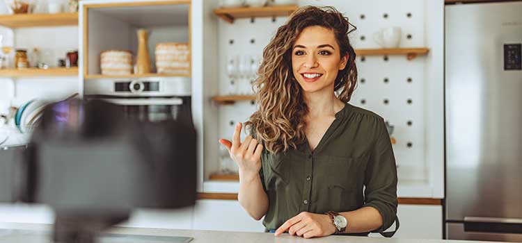 social media influencer recording her show in kitchen